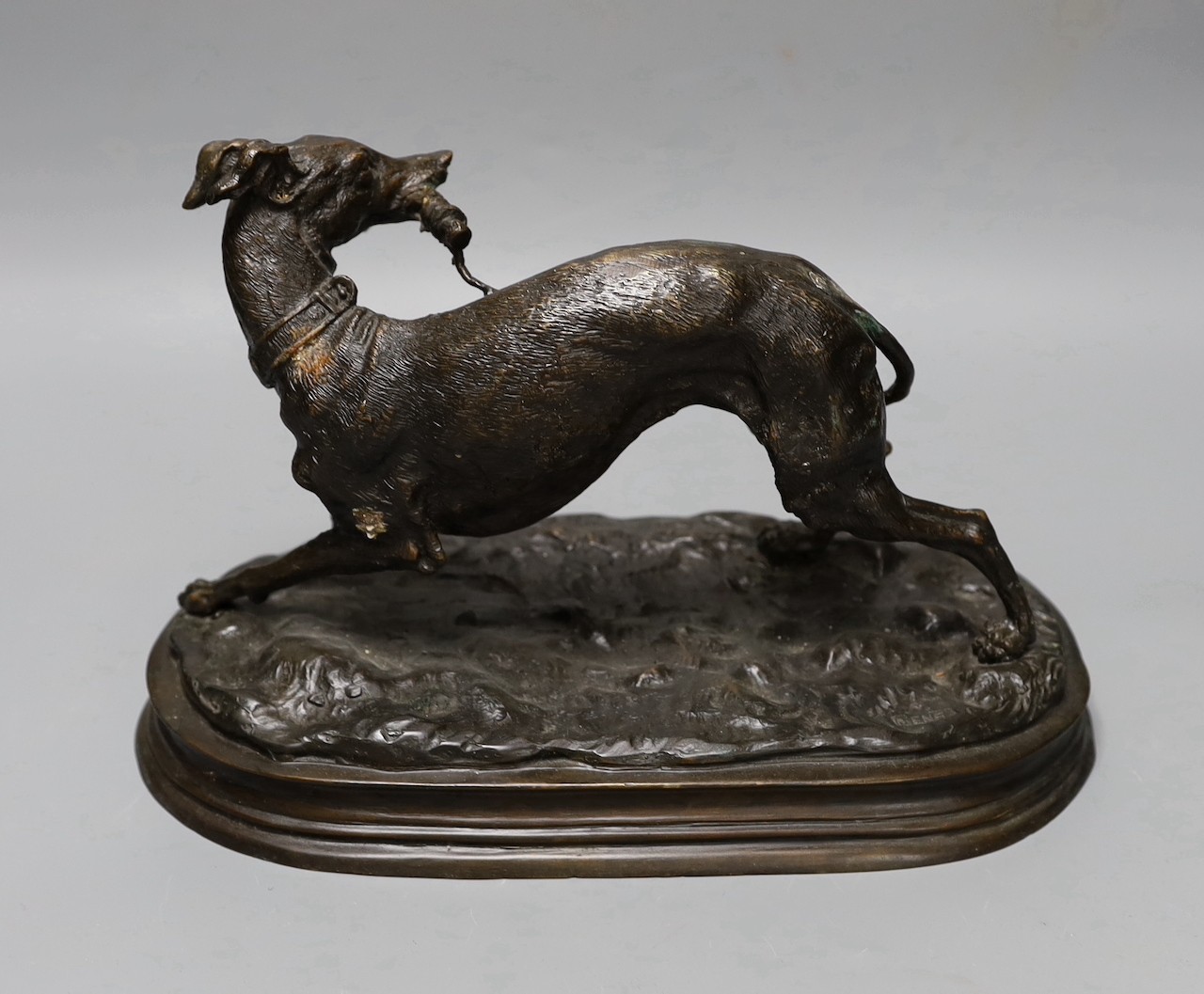 After Mene, a bronze figure of a whippet, 31cms wide.